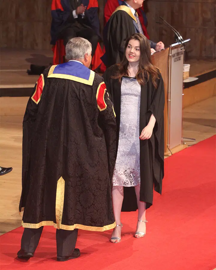 Abigail in graduation robes
